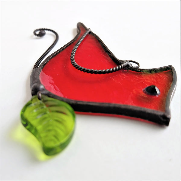 Stained glass cardinal ornament.